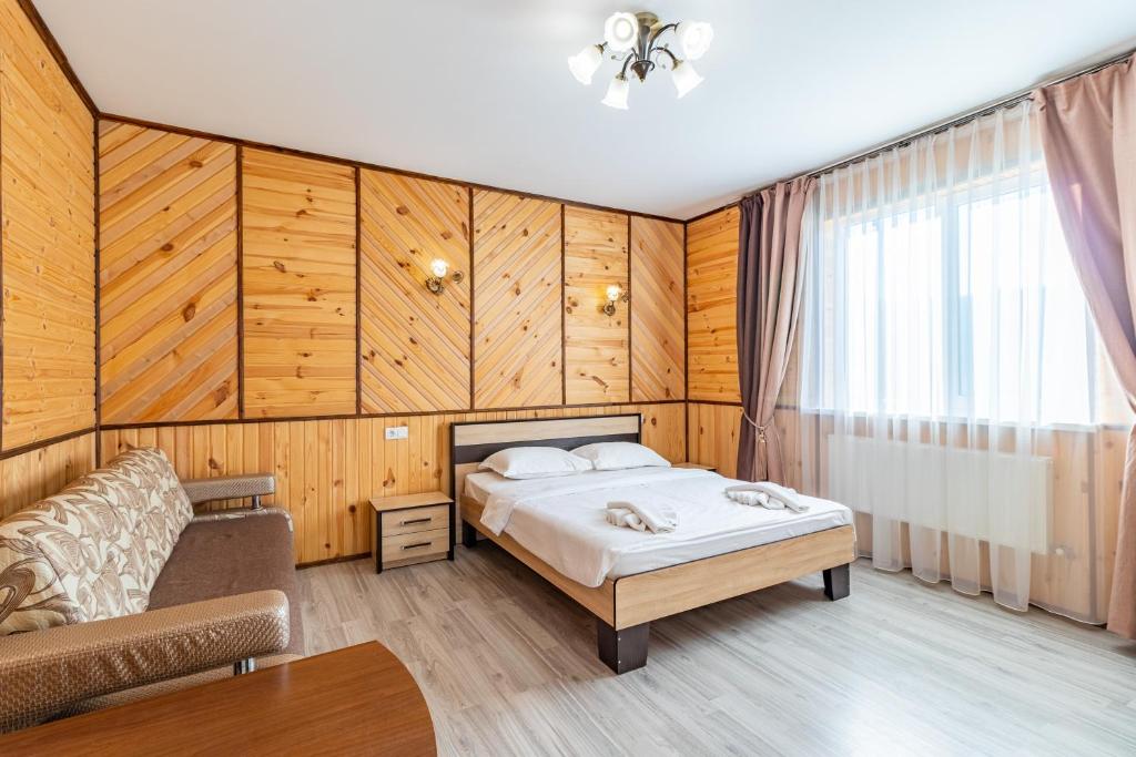 Postel nebo postele na pokoji v ubytování Zeleniy Bir