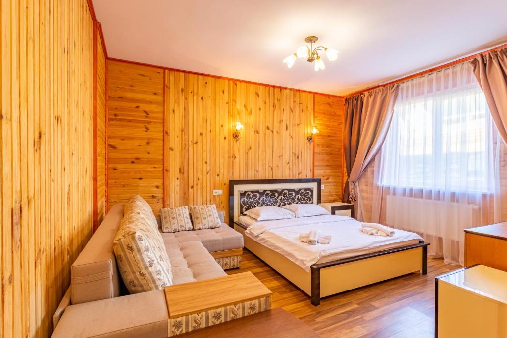 Postel nebo postele na pokoji v ubytování Zeleniy Bir