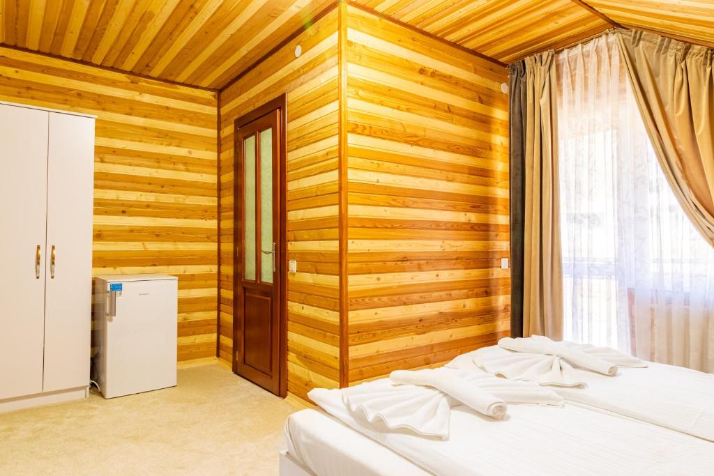 Postel nebo postele na pokoji v ubytování Zeleniy Bir