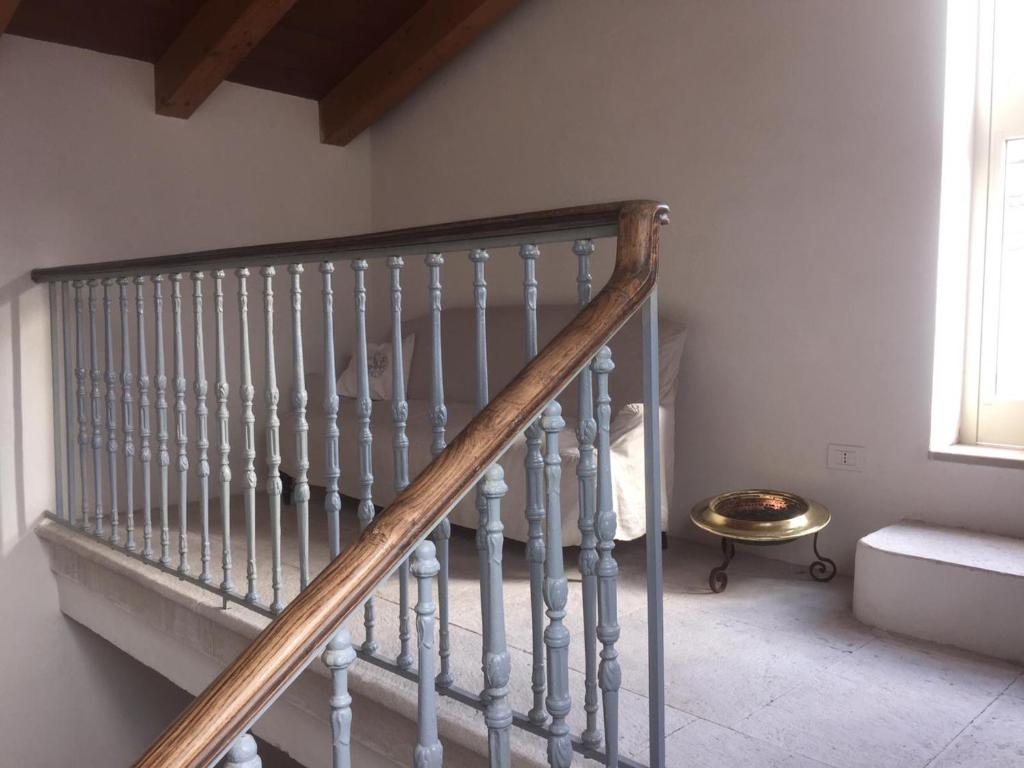 Postel nebo postele na pokoji v ubytování Palazzo Romanelli B&B