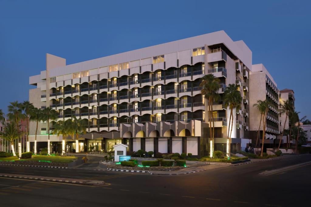 a large building with a lot of windows at Al Hamra Hotel Jeddah in Jeddah