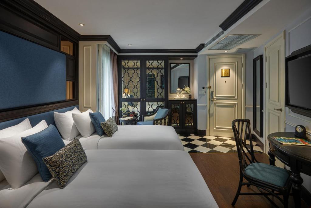 Кровать или кровати в номере Aira Boutique Hanoi Hotel & Spa