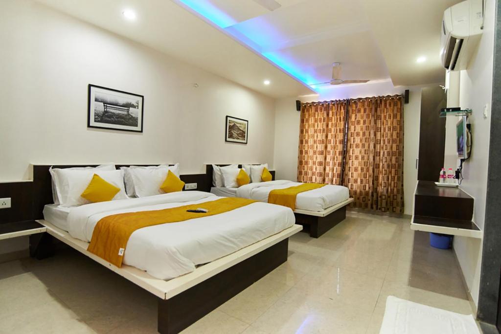 Cama o camas de una habitación en Hotel Sai Bansi