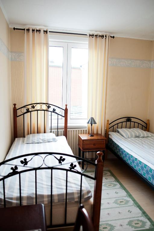 Postel nebo postele na pokoji v ubytování Reftele Wardshus