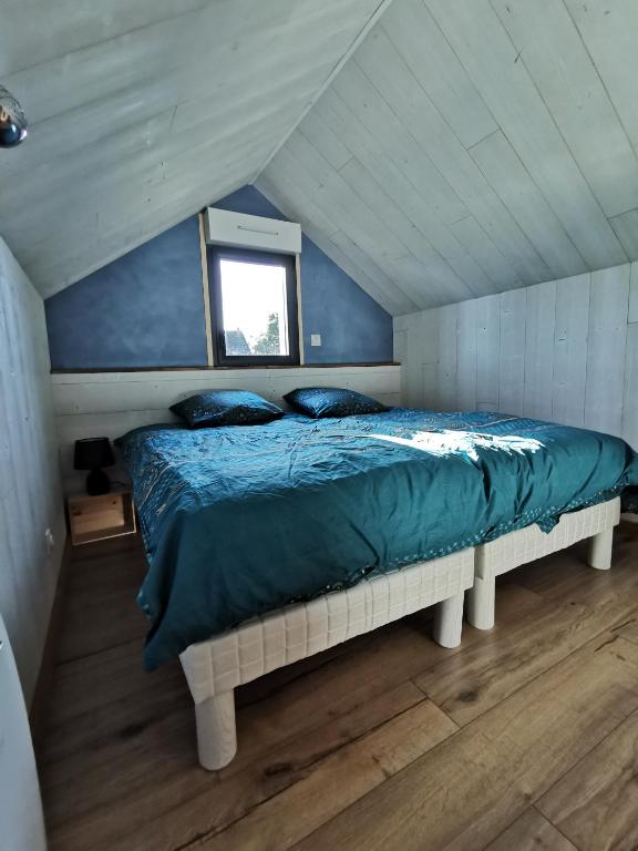 Кровать или кровати в номере Le Petit Renard