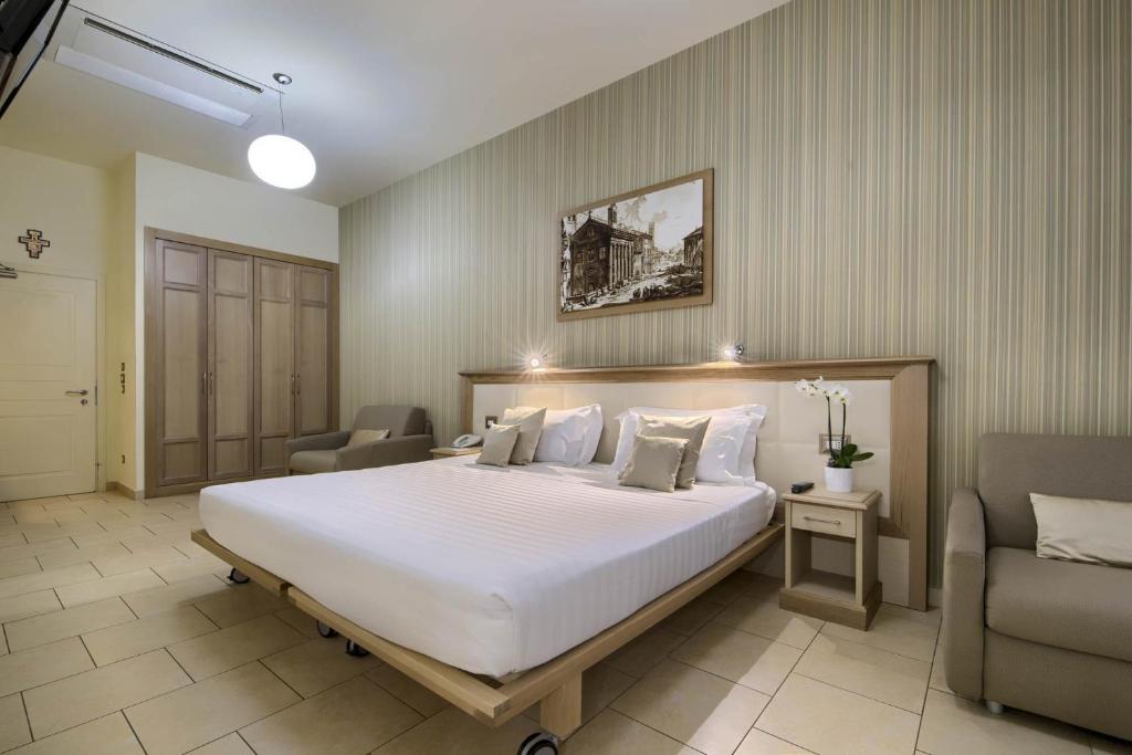 Postel nebo postele na pokoji v ubytování Domus Australia