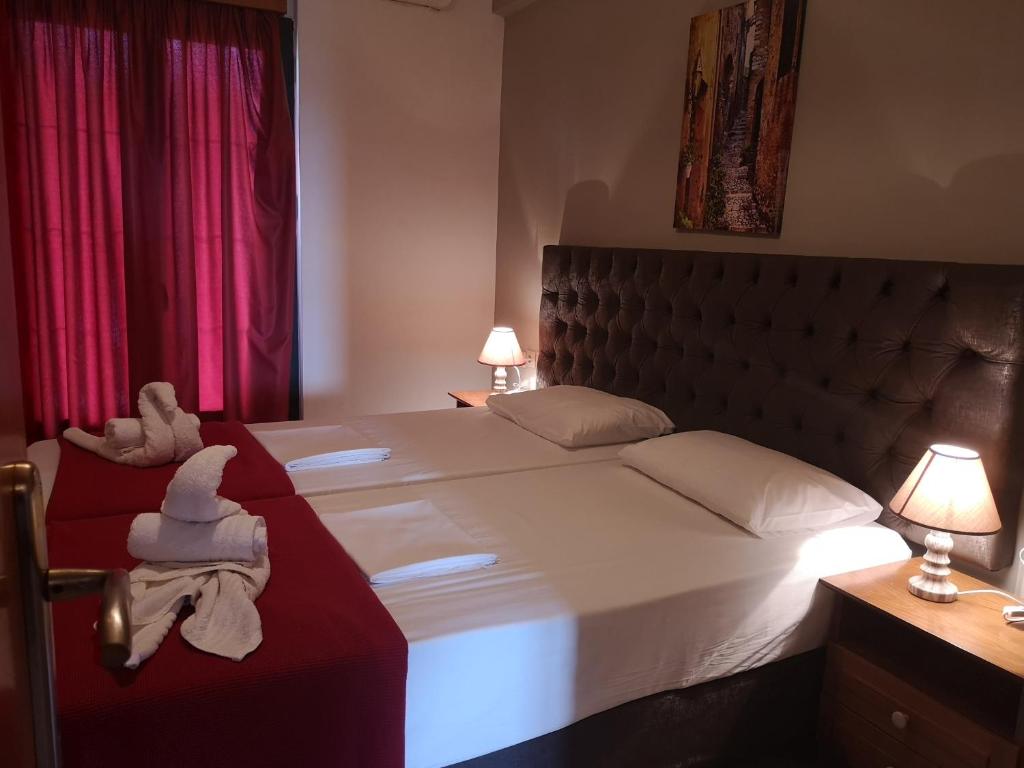 Posteľ alebo postele v izbe v ubytovaní Ionion Apartments & Studios
