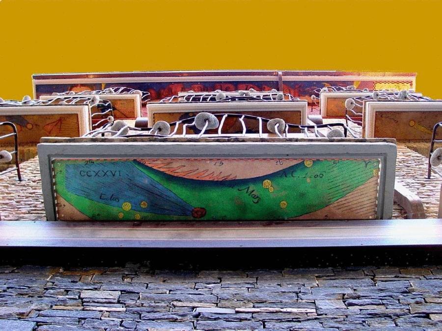 a suitcase with a painting of a boat on it at Hospedium Hotel Posada De La Luna in Huesca