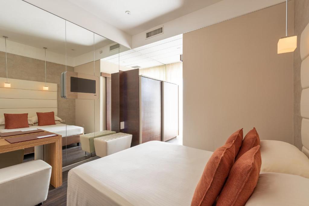 A bed or beds in a room at Bio Boutique Hotel XU' - Gruppo Ambienthotels