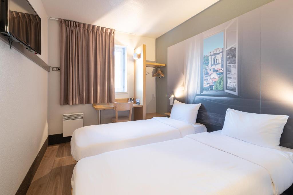 Postel nebo postele na pokoji v ubytování B&B HOTEL Avignon 2