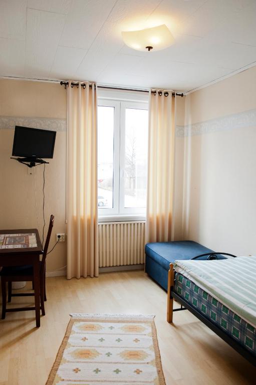 Postel nebo postele na pokoji v ubytování Reftele Wardshus