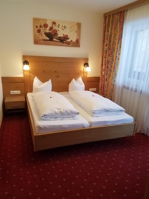 Postel nebo postele na pokoji v ubytování Aparthotel Hohe Brücke