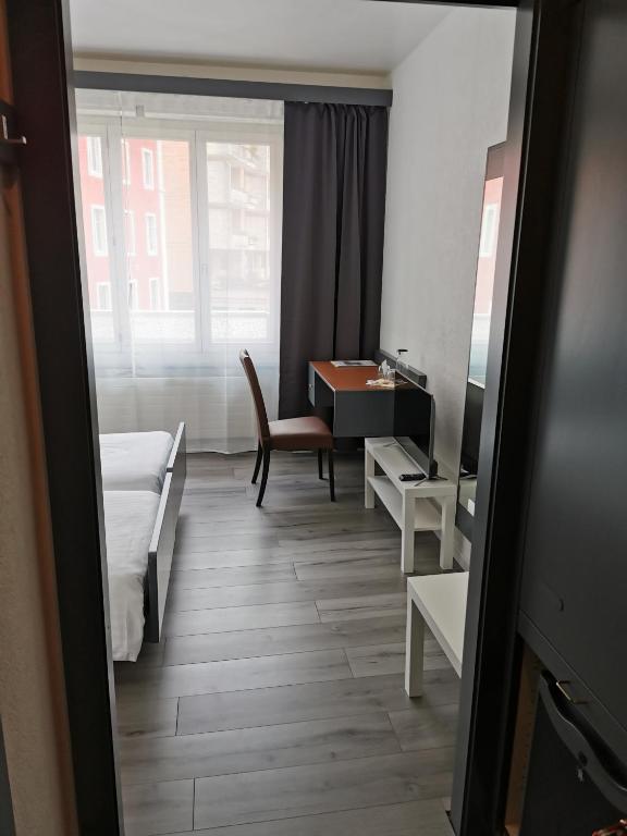 Postel nebo postele na pokoji v ubytování Hotel Fleur-de-Lys