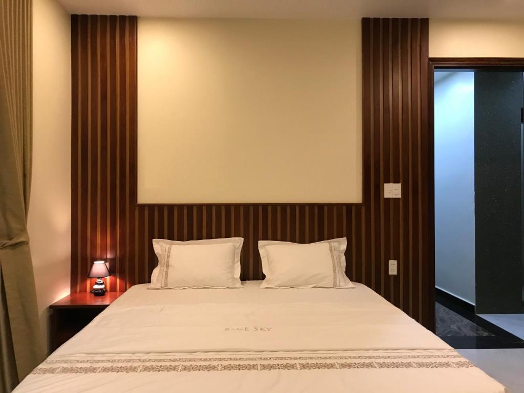 Giường trong phòng chung tại SAOLA Apartment & Hotel