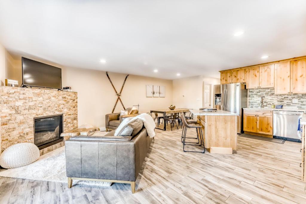 a living room with a couch and a fireplace at Heavenly Hideaway in Stateline