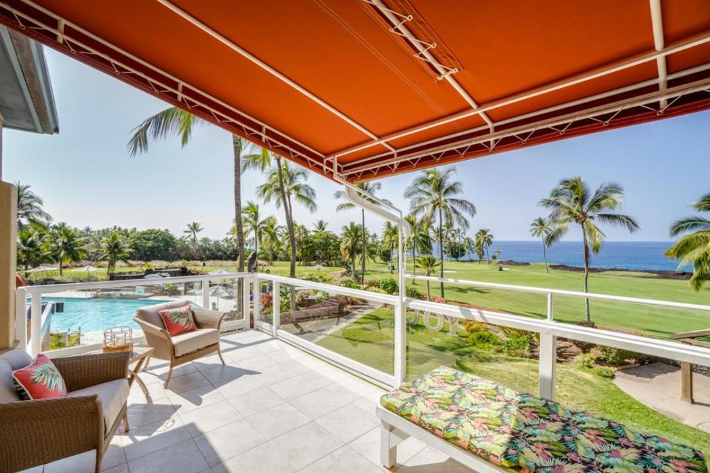 a view of the ocean from the balcony of a villa at Keauhou Gardens Penthouse 22B at Kona Coast Resort in Kailua-Kona