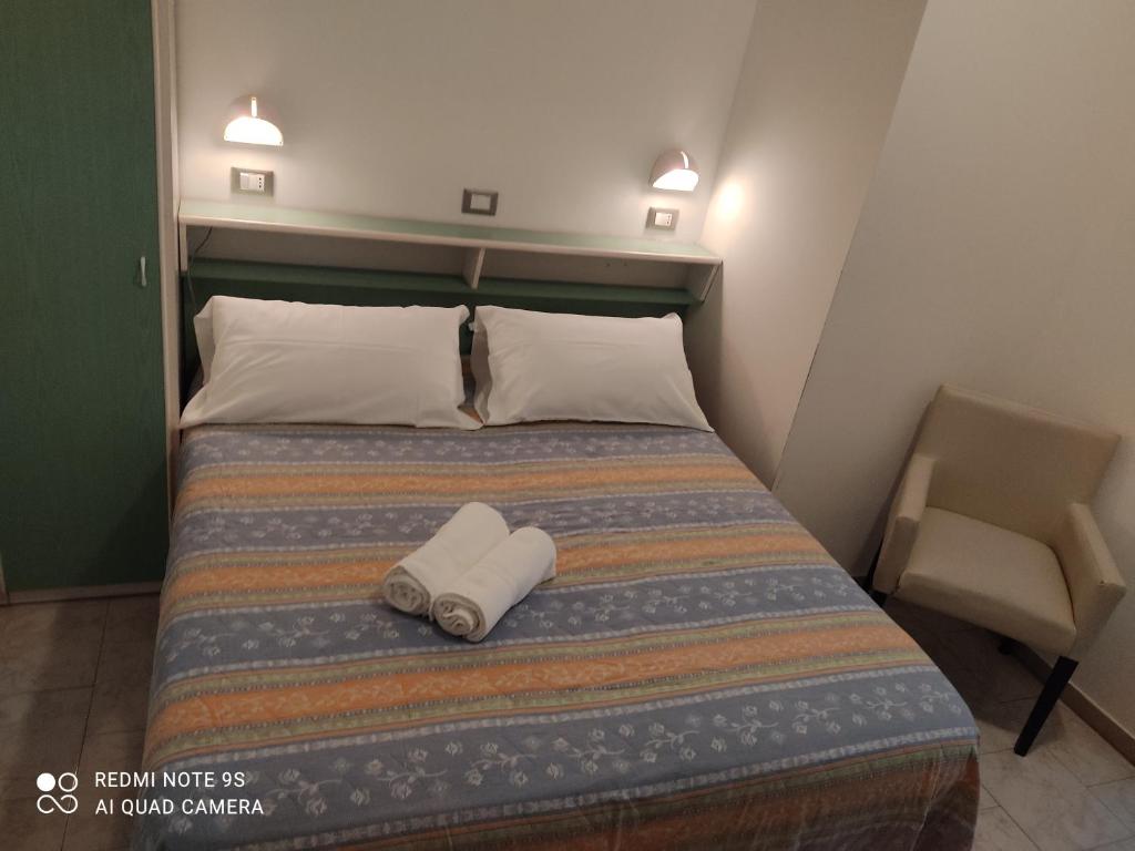 Postel nebo postele na pokoji v ubytování Kristalex Pet Family Hotel