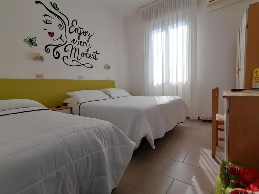 Postel nebo postele na pokoji v ubytování Kristalex Pet Family Hotel