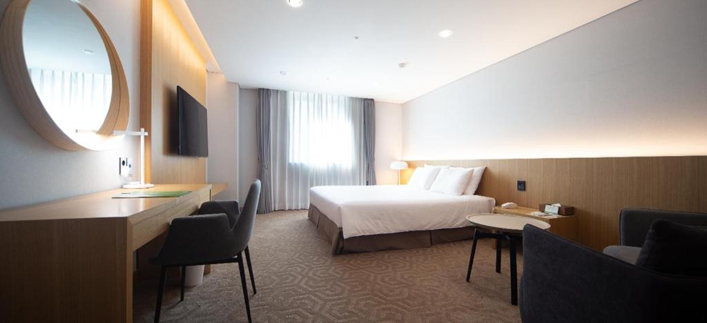 Krevet ili kreveti u jedinici u okviru objekta Ulsan City Hotel