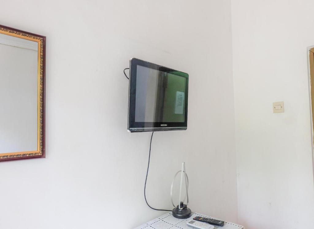 TV a/nebo společenská místnost v ubytování Umah Hijau Tabanan