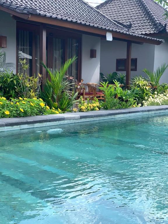 Bazén v ubytování Paraiso Cottage Ubud nebo v jeho okolí