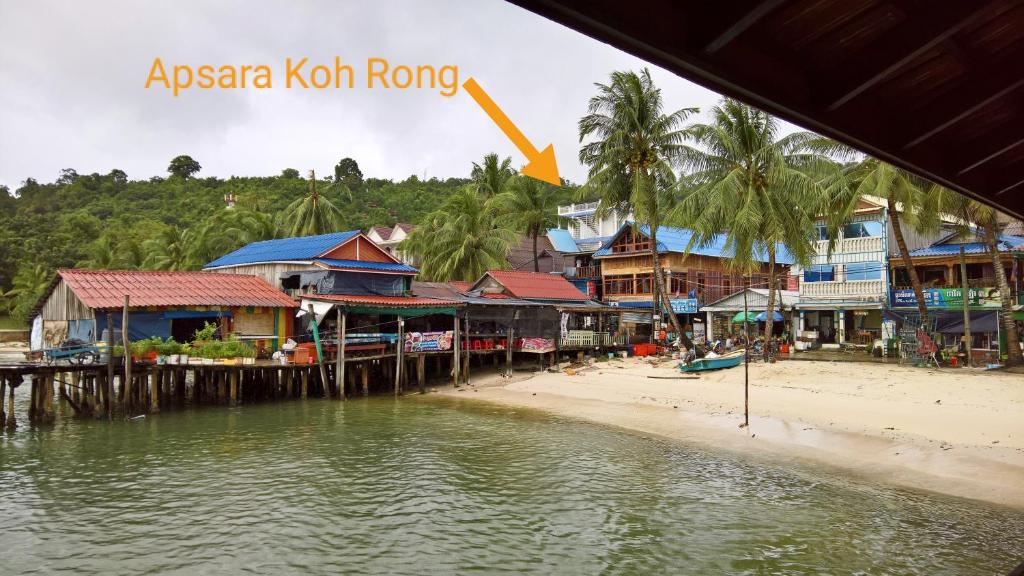 a town on a beach next to a body of water at Apsara Koh Rong Guesthouse in Koh Rong Island