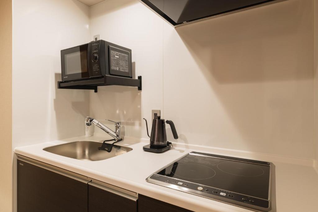 Kuchyň nebo kuchyňský kout v ubytování Hotel Iori