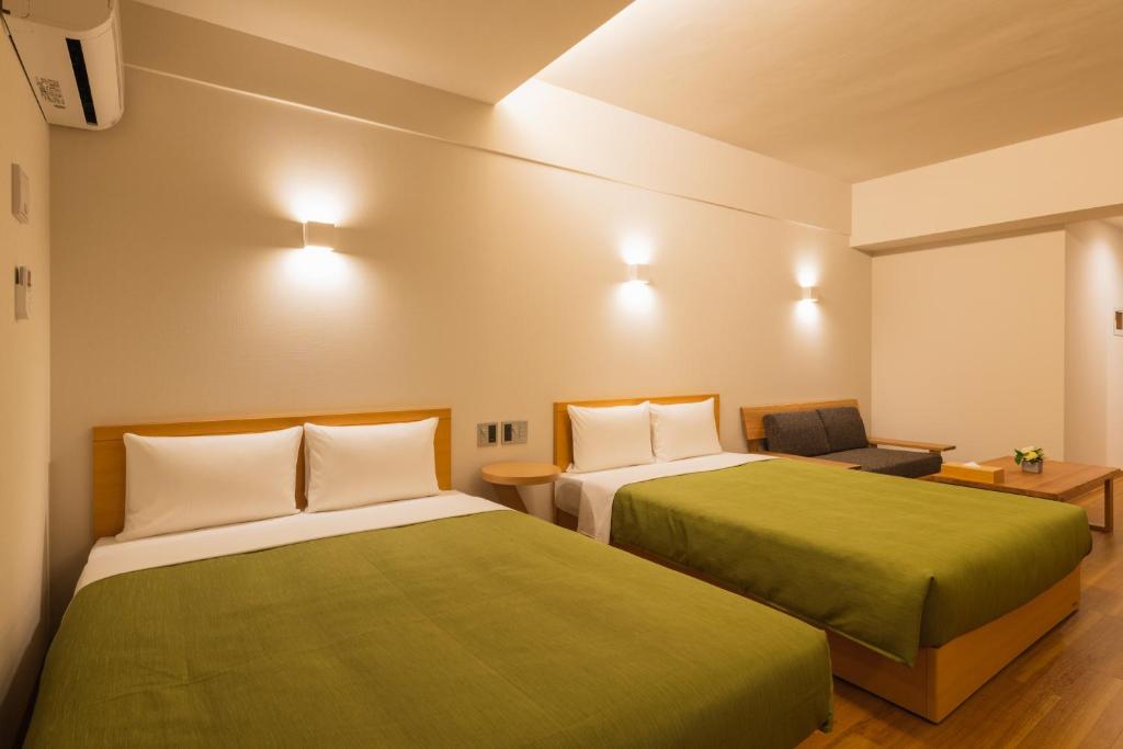 Postel nebo postele na pokoji v ubytování Hotel Iori