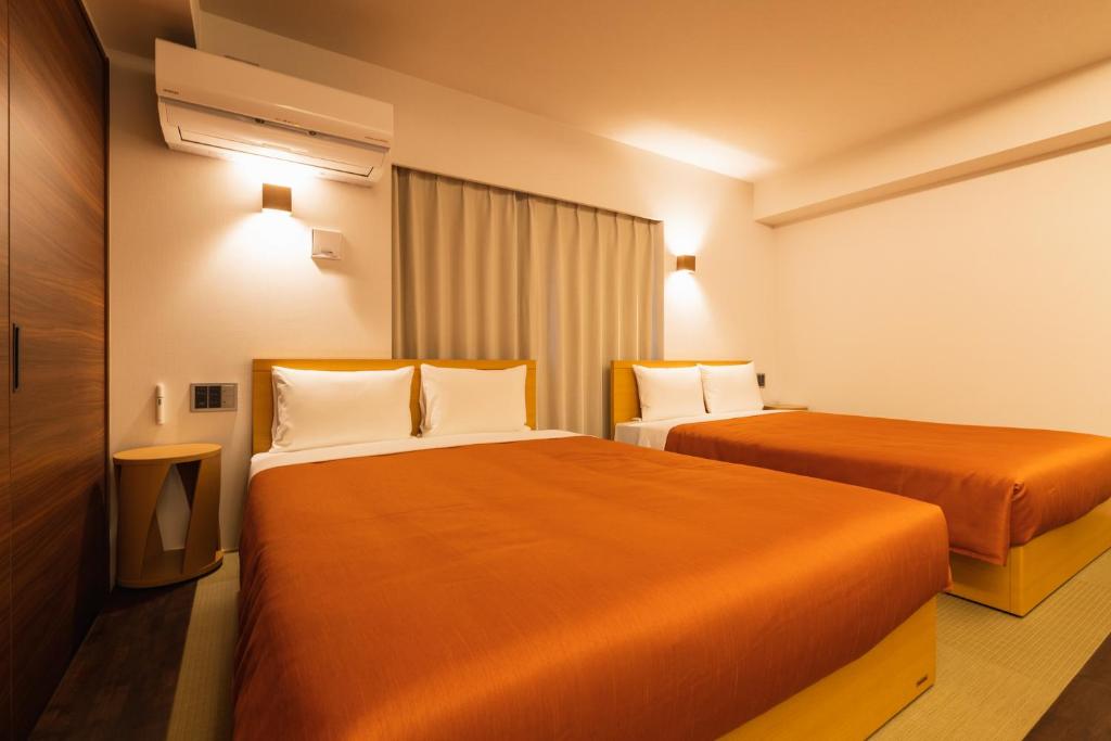 Postel nebo postele na pokoji v ubytování Hotel Iori
