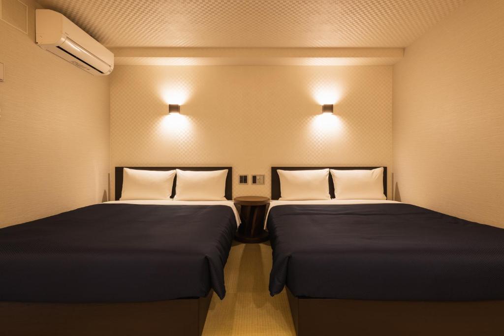 Postel nebo postele na pokoji v ubytování Hotel Iori