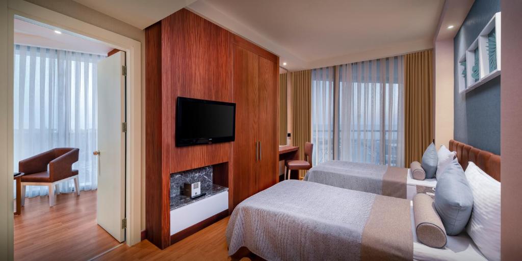 Postel nebo postele na pokoji v ubytování Baia Lara Hotel