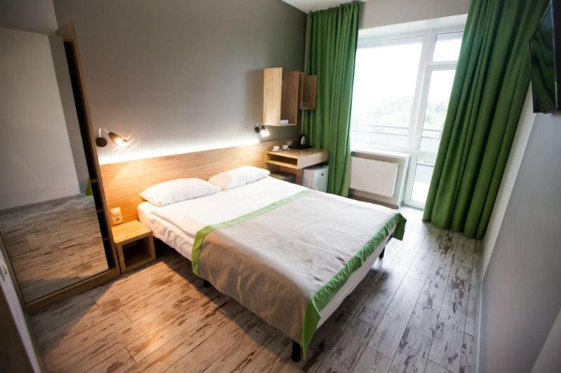 Postel nebo postele na pokoji v ubytování Hotel Vesna