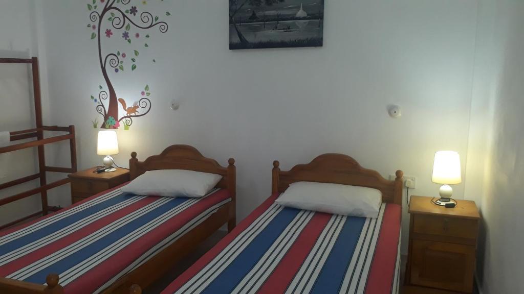 Postel nebo postele na pokoji v ubytování Basilico Homestay