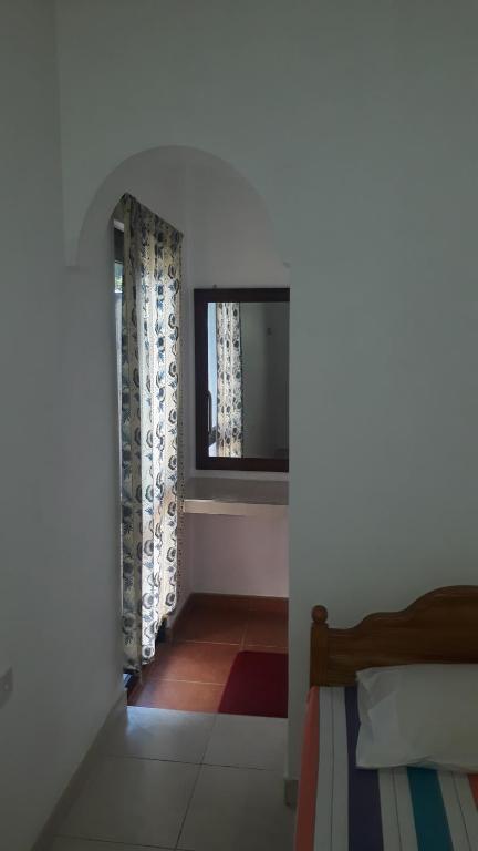 Postel nebo postele na pokoji v ubytování Basilico Homestay