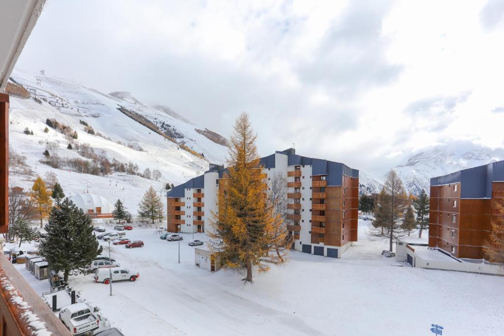 an aerial view of a building in the snow at Vacancéole - Résidence Meijotel in Les Deux Alpes