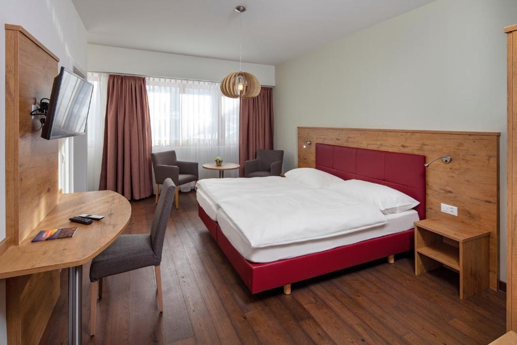 Postel nebo postele na pokoji v ubytování Hotel Roggen