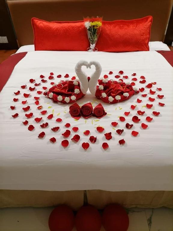 Postel nebo postele na pokoji v ubytování Muscat Gate Hotel