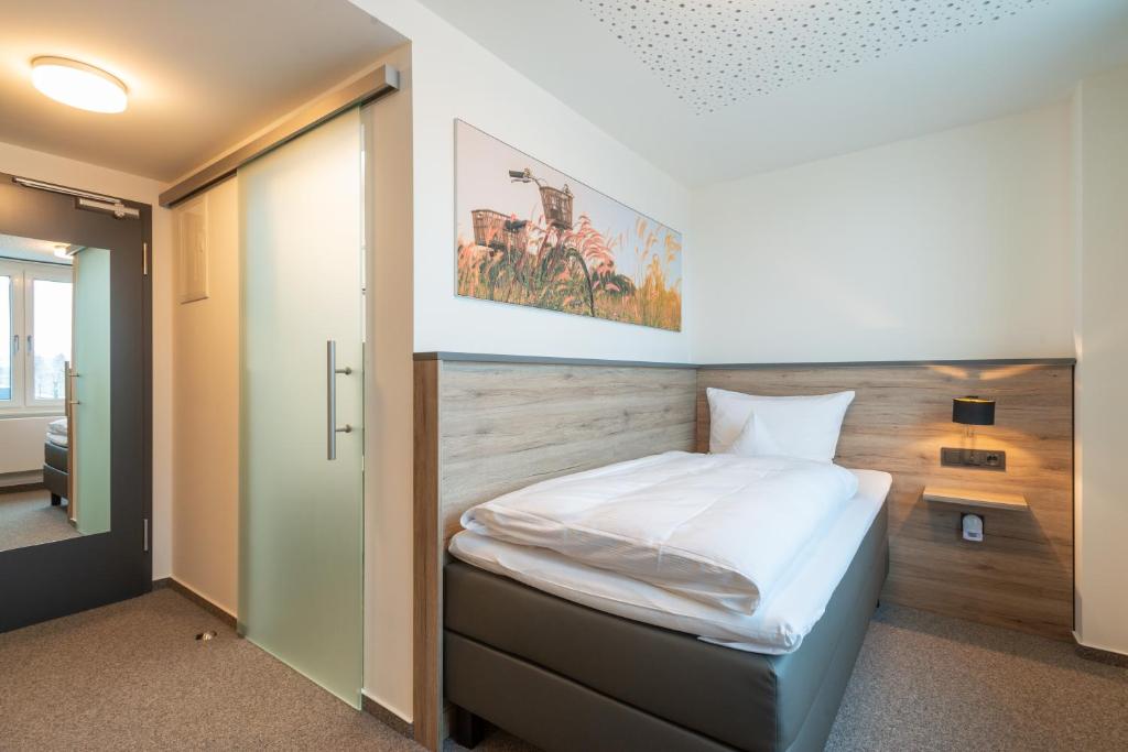 Postel nebo postele na pokoji v ubytování Leinotel