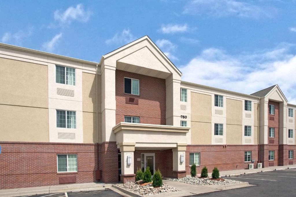 a rendering of an apartment building at MainStay Suites Omaha Old Mill in Omaha