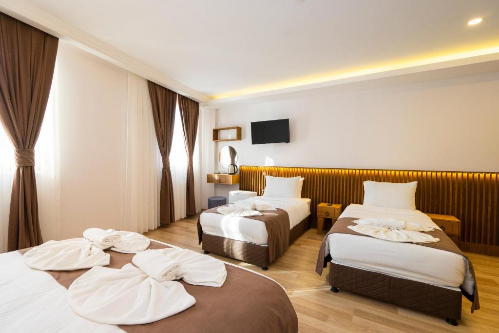 A bed or beds in a room at Castillo Rojo Hotel Istanbul