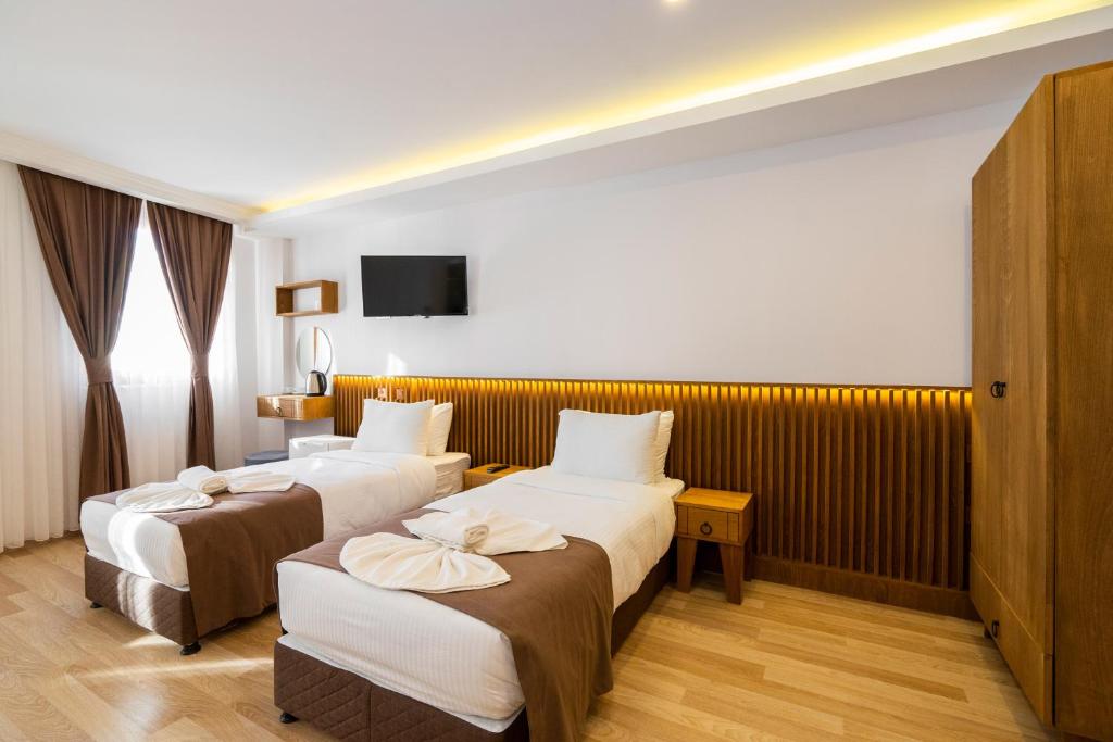 A bed or beds in a room at Castillo Rojo Hotel Istanbul