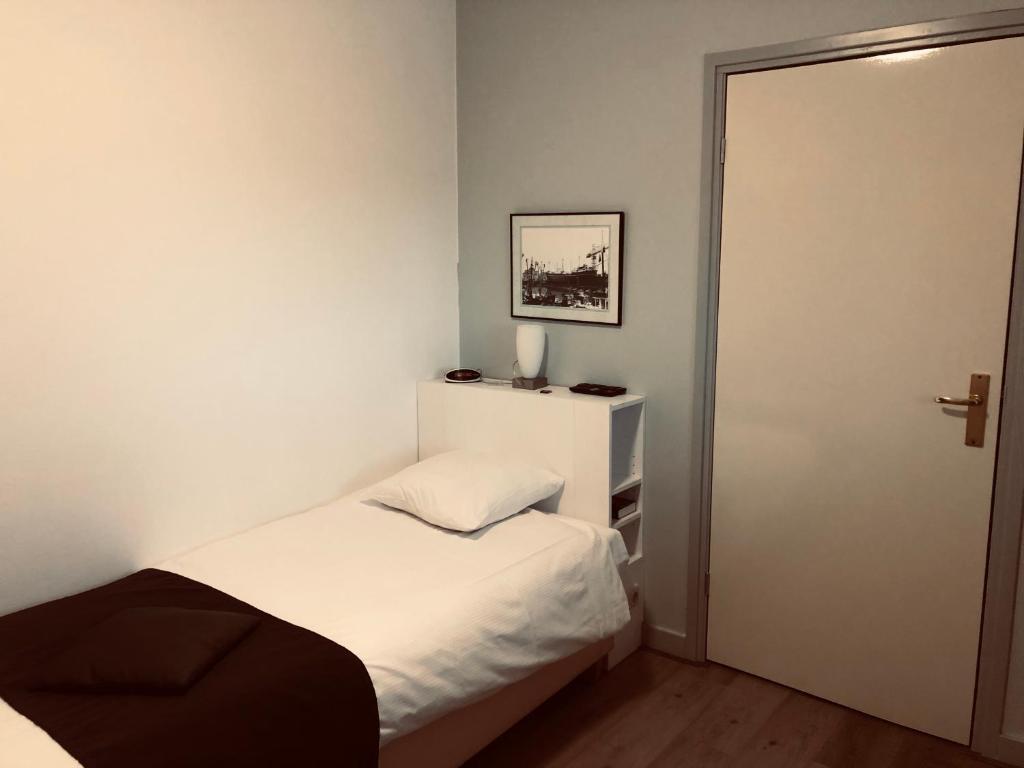 Postel nebo postele na pokoji v ubytování Hotel Centraal