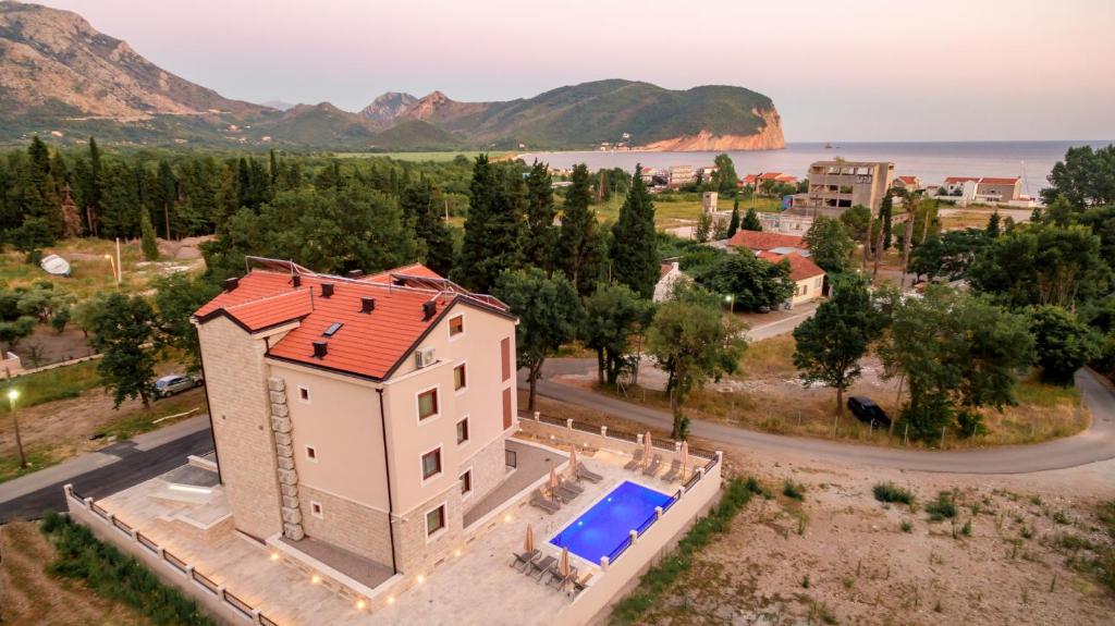 an aerial view of a house with a swimming pool at Luxury Apartments Queen in Petrovac na Moru