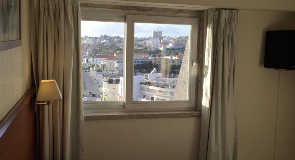 En TV eller et underholdningssystem på Hotel Sao Mamede Estoril