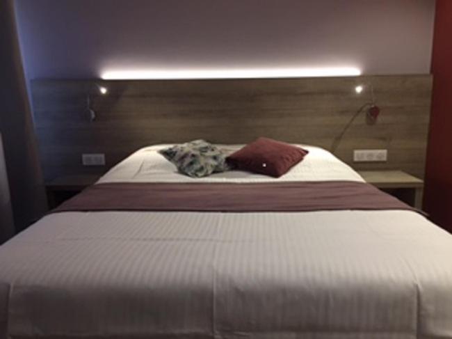 Postel nebo postele na pokoji v ubytování L'Hôtel des Bords de L'ill