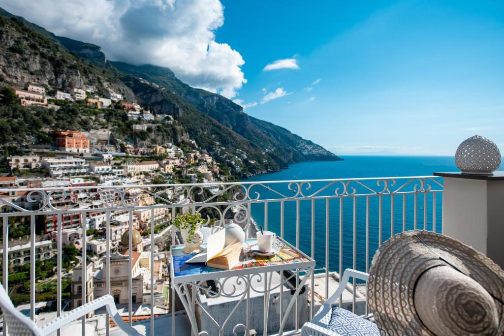 a balcony with a view of the amalfi coast at Hotel Reginella in Positano