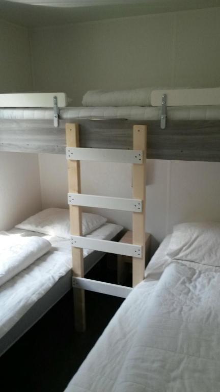 Postel nebo postele na pokoji v ubytování Greenchalets Roquebrune Sur Argens