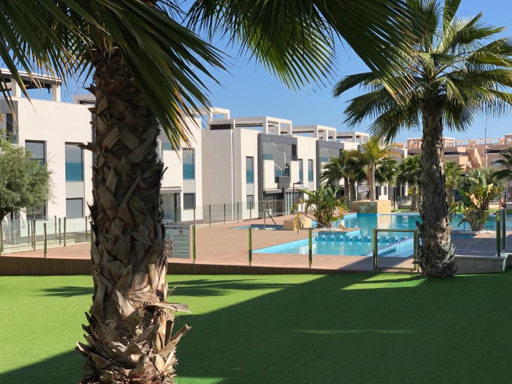 Swimmingpoolen hos eller tæt på OASIS BEACH 7 - Apartment Lundgren