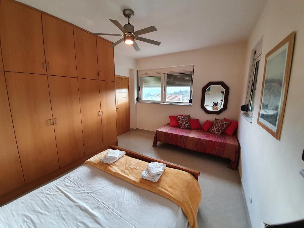 A bed or beds in a room at Argo Villa Kalives