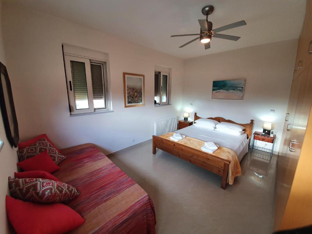 A bed or beds in a room at Argo Villa Kalives